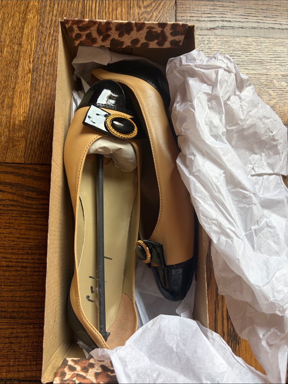 Brand new in box. Tan and Black Women's Leather Ballet Flats with Gold Buckle